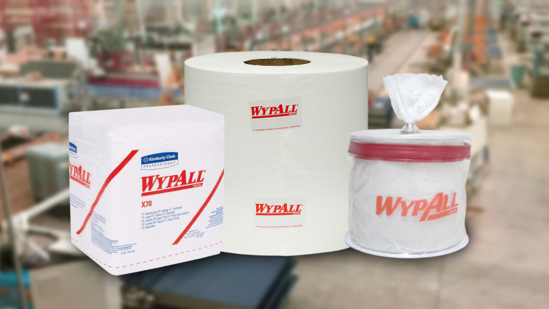 person holding blue textile near clear glass bottle